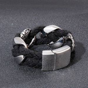 Detail of men's braided leather bracelet with silver stainless steel magnetic clasp