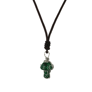 Detailed view of handmade wire wrapped green crystal mushroom pendant with woven cord