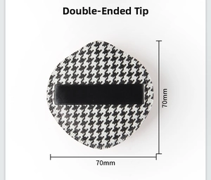 Detail view of houndstooth makeup puff showing 70x70mm size and dual pointed shape