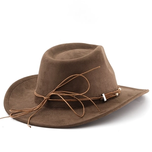 Detail view of brown faux suede cowboy hat with decorative cord and silver metal hardware