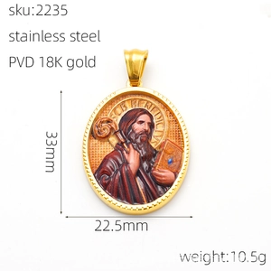 Macro shot of 18K gold plated oval religious pendant with detailed Saint relief engraving