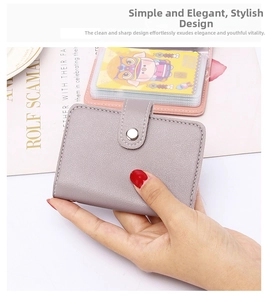Close-up of lavender faux leather card holder with multiple PVC slots and metal button