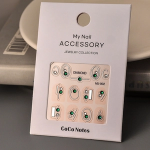 Golden bronzing nail stickers with 3D green and silver K9 rhinestones, model MJ-002