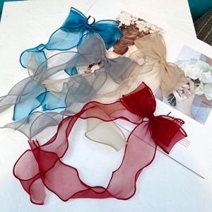 Large organza bow hair clips with long ribbons in navy, grey, champagne, and burgundy colors