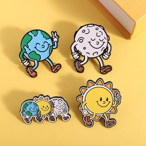Cartoon enamel pin set featuring Earth, Moon, and Sun on a warm yellow background