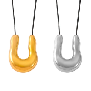 Fashionable titanium U-shaped pendants in gold and silver on black woven leather cords