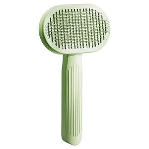 Self-cleaning cat grooming brush with stainless steel bristles and mint green ergonomic handle