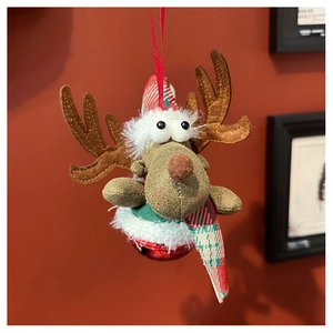 Detail of reindeer plush ornament with red knit hat, scarf and a small metal bell
