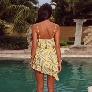 Back view of summer yellow zebra print dress with tiered ruffles and open back design