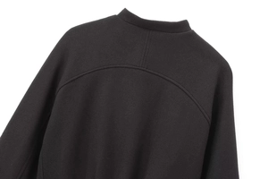 Detail of the high-quality stitching and collar construction on this black bomber jacket