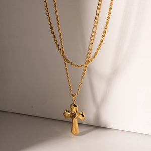 Layered gold vintage cross necklace with amber stone pendant and elegant shadow aesthetic