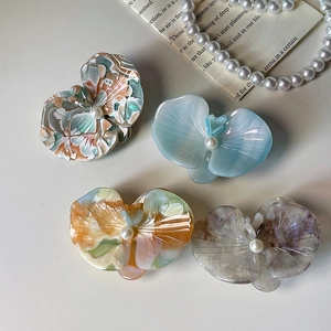 Chic acetate orchid flower hair clips with pearl centers in four pastel colors