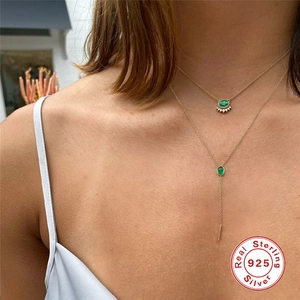 Double-layered 925 sterling silver gold necklace set with oval emerald green stones