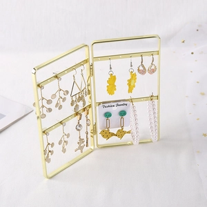 Golden folding metal jewelry display stand for earrings shown from a 45-degree angle