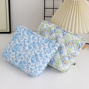 Quilted floral cotton makeup bag set with zipper closure and rustic floral patterns