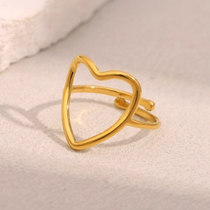 Minimalist 18K gold-plated stainless steel hollow heart open ring on stone pedestal