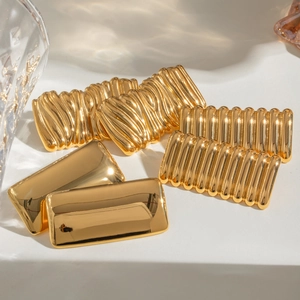 Set of 6 golden geometric square earrings with smooth and textured wavy metal finishes