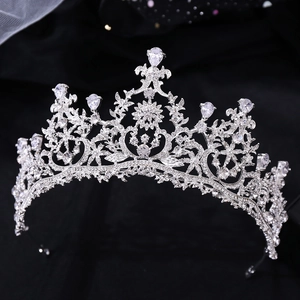 Close-up of sparkling bridal tiara with silver filigree and teardrop zircon crystals