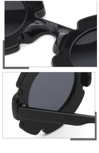 Close-up of integrated nose pads and durable metal screw hinges on black flower sunglasses