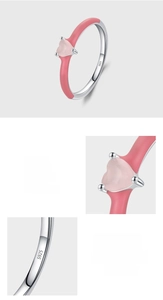 Detail of S925 silver ring featuring pink enamel and heart-shaped cubic zirconia stone