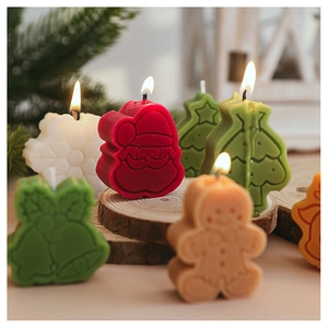 Detailed Christmas candles featuring Santa Claus, snowflakes, and festive tree shapes