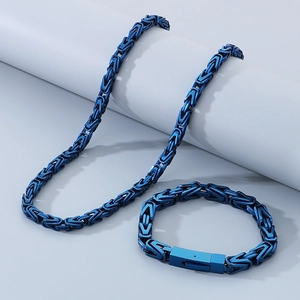 Detail of blue Byzantine weave stainless steel necklace and bracelet set on display