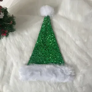 Close-up of green sequin Christmas hat with soft white plush trim on fluffy background