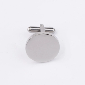 Close-up of polished silver round cufflinks with T-bar swivel back for formal shirts