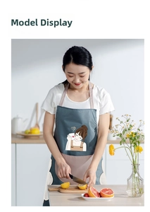 Detail of waterproof kitchen apron with cute girl print and large front storage pocket