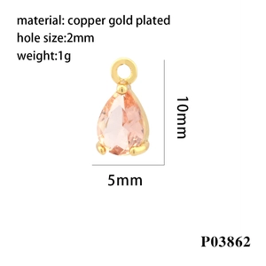Macro detail of a 5x10mm pink teardrop zircon charm in gold plated copper material