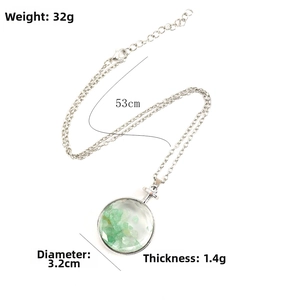 Polished round pendant filled with green natural stones on 53cm silver chain necklace