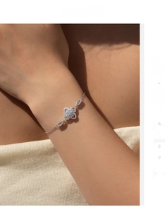 Close-up of S925 sterling silver floral bracelet with sparkling zircon on a woman's wrist
