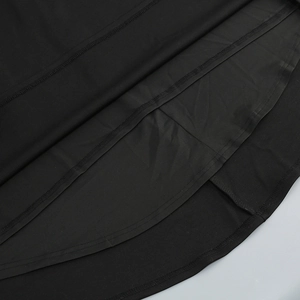 Detailed close-up of the professional stitching and hem of this black fishtail evening dress