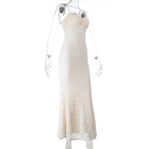 Detailed view of white lace camisole maxi dress with intricate embroidery and slim fit