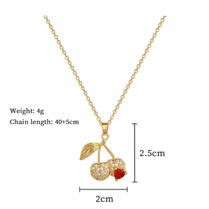 Macro view of gold cherry necklace dimensions showing 2x2.5cm pendant and 4g weight