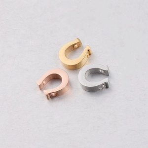 Polished stainless steel horseshoe pendants in gold, silver, and rose gold finishes
