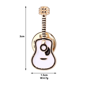 Detailed macro view showing the guitar brooch dimensions 3cm by 1.5cm and 4.7g weight