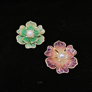 Exquisite enamel flower brooch with pearl center and golden edges in green and purple colors
