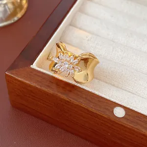 Luxury 18K gold plated flower ring with sparkling zircon stones and wide wavy band