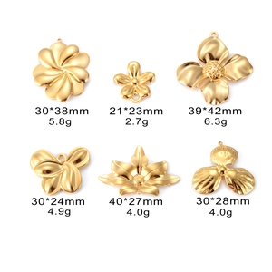 Macro view of 18k gold plated flower and leaf charms for DIY jewelry making with dimensions