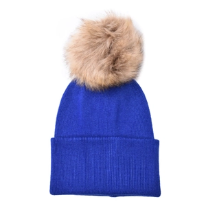 Detail of royal blue ribbed knit beanie with soft faux fur pompom for kids