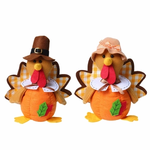 Set of two Thanksgiving plush turkey gnomes with autumn leaves on white background