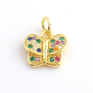 Detail of a gold butterfly pendant with colorful zircon stones on a white background