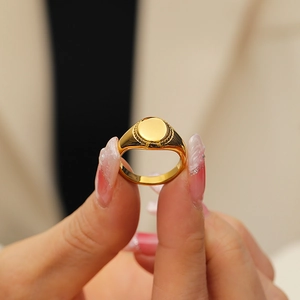 Detailed view of vintage hammer-textured 18k gold plated ring on a finger