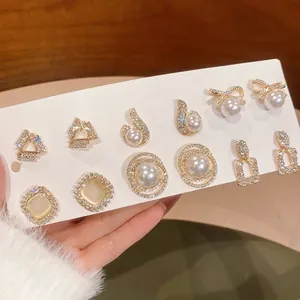 Elegant 6-pair gold earring set featuring faux pearls and sparkling cubic zirconia crystals