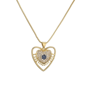Gold plated heart pendant necklace with blue cubic zirconia evil eye design on white background