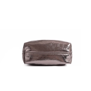 Detailed base view of silver pleated cloud bag with textured leather and stitching