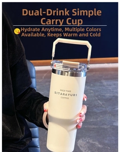 Detail of cream white insulated tumbler featuring dual drinking lids and a portable handle
