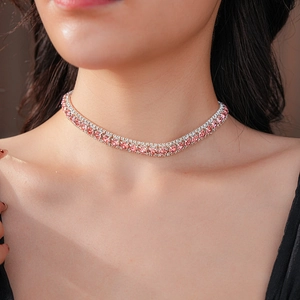 Close-up of elegant double-row silver choker with sparkling pink rhinestones on a model