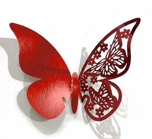 Close-up of bright red 3D butterfly wall sticker with intricate hollowed-out wing pattern